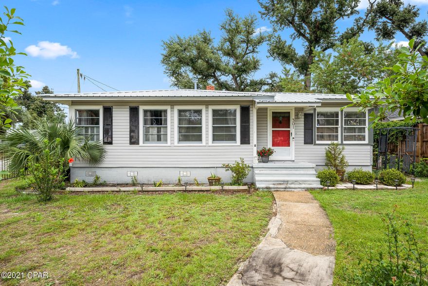 Fixed two blocks from St,Andrews bay, this charming cove home offers beautiful oak trees, large corner lot, a brand new roof from June of 2021, and is completely fenced in. This home features a three bedrooms, one bathroom and 1,086 square feet. most of the flooring in the home is the original hard wood floors, the rest of the flooring is wood plank flooring that matches the original hardwood. This home also has a new water heater, deep water well, new attic insulation 2018. The cove is a very charming neighborhood, offering close proximity to shopping and dinning in down town Panama city, and is a 2 minute walk to St. Andrews Bay to watch the best sunsets in town.