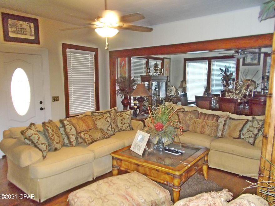 Nice large Southern style home built in the 40''s large screened front and back porches,  very large living/dining room, one bedroom on the main floor the rest are upstairs, this home has had some updates and is move in ready. 3 bedrooms and  a bathroom upstairs,,2.5 ac on a corner lot in town, there is a new grocery store going up a couple blocks away, just a short drive to Wal Mart in Marianna and I 10.