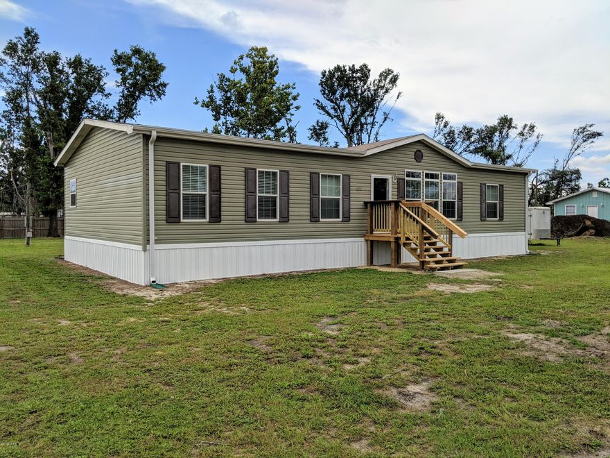 OPEN HOUSE SATURDAY 9/21 FROM 2 TIL 5. Like new mobile home located off the fast growing Cato Rd area. Home was built in 2015 on a little over an 1/2 acre lot with new septic installed in 2015. 3 bedroom, 2 bath with office/study. HUGE kitchen and Greatroom area. Kitchen has a large island with a separate sink. Laundry room conveniently off the kitchen. There is also a workshop as well as a shed in the backyard. Call for your showing today!