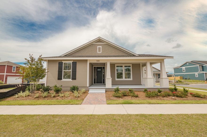 This home features the Orchid floor plan with a Boatbuilder Elevation.  Samuel Taylor homes are truly one of the best constructed homes in Bay County. We build our homes with 2x6 exterior studs vs other builders using 2x4's. Not only is it a stronger home, but this also allows us to put R-19 in the walls instead of R-13.  We also use R-38 in our ceilings vs R-30 like most builders. We insulate most of the interior walls to make a very quiet home. SS appliance package is standard along with brushed nickel faucets, security system, 8 ft. doors throughout, granite counters in kitchen and baths, raised vanities with under mounted porcelain sinks, SS gas oven, oversized tiles, upgraded carpet with 8lb padding and much more.
   A craftsman style trim package adds to the character and uniqueness of our homes. Choose from 3 exterior elevations: Classic, Coastal, or Boat builder. Pick from traditional style garages or our detached garages with optional carriage home above, perfect for the college student, guests or in-law quarters.
   SweetBay offers biking and hiking trails, a boathouse to launch canoes, kayaks and paddle boards, a permitted marina, community pool (construction to start 2017), several parks, ponds, children's playground, planned township with a major grocery store and many shoppes. Everything is within a 5 minute walk or less.  University Academy is the center of this beautiful community. The Academy is the #1 school for math and reading for the Bay County District. Your children are priority for enrollment with purchase of a home. Currently there are over 1000 on the waiting list to get in to the school. Come see what everyone is talking about!
