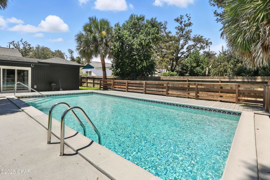 One of the lowest price per sqft homes in The Cove! This stunning POOL HOME in the desirable Bunkers Cove has been masterfully and COMPLETELY RENOVATED from top to bottom. The inviting front porch welcomes you into the front sitting room - where the charming fireplace and stylish decor immediately set a tone of warmth and luxury. Quartz countertops and stainless steel appliances highlight the gleaming kitchen while sleek vinyl plank flooring extends throughout the entire home - no carpet! With 4 bedrooms and 2.5 baths, the semi-open floor plan connects multiple living and flex spaces with endless possibilities. Whether you envision a dedicated home office, a hobby room, or a private home gym, this residence has the square footage and intelligent layout to accommodate your preferences. 

The primary suite is a true retreat. Its gorgeous en-suite bathroom features both a timeless clawfoot tub and a separate, beautifully tiled walk-in shower with frameless glass. The real game-changer is the massive walk-in closet, which includes its own private laundry hookup for convenience. Upstairs in the loft area, an additional spacious bedroom offers a private balcony overlooking the incredible backyard. The sparkling in-ground pool is framed by durable, low-maintenance Trex decking, which creates an expansive and impressive space designed for endless outdoor enjoyment. The spacious patio offers ample room for grilling and hosting, all within the fully-fenced yard that provides privacy plus convenient back alley access.

This property offers more than just cosmetic beauty; it provides true peace of mind. The renovations were not just an aesthetic refresh, but a comprehensive update with key systems upgraded, including the 2019 roof, two high-efficiency HVAC systems, two water heaters (one tankless), new siding, new windows, fully updated electrical and plumbing, plus energy-saving spray foam insulation. To complete this truly turnkey experience, the home is expertly furnished, with all furnishings negotiable with the sale of the home. With its rare combination of size, style, and top-to-bottom renovation in an unbeatable Bunkers Cove location, this home truly has it all. Schedule your private showing today and prepare to fall in love!