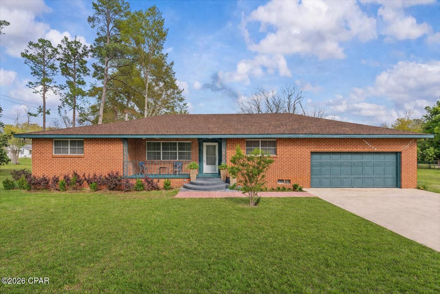 Stunning, fully renovated brick ranch on a level 1-acre lot in the heart of Graceville! This spacious 2,023 sq. ft. home features an open-concept layout, massive rooms, and a formal dining area. Major 2023-2024 updates include a NEW ROOF, new insulation, upgraded electrical, luxury vinyl plank flooring, and brand-new appliances, including the washer and dryer.

The interior boasts fresh paint, LED lighting, and remodeled bathrooms with modern fixtures and tile. Each spacious bedroom features double walk-in closets with upgraded plantation doors. For added convenience, the home includes a laundry room and a dedicated storage room located on the covered back porch.

Outside, enjoy a private driveway, a 2-car attached garage, and a lush 1-acre yard filled with crepe myrtles, camellia roses, and fig trees. The property is fenced on both sides with paved frontage on 8th and 7th Ave. This home is completely move-in ready, offering the perfect blend of space, privacy, and modern updates!