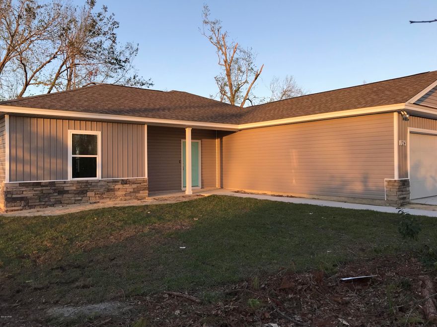 LYNN HAVEN- Coomplete and ready for occupancy!!!  NEW CONSTRUCTION-3 BED/2 BATH-easy access to Panama City's main shopping corridor, Tyndall AFB, and the Naval Coastal Systems Base. Interior of home offers upgraded lighting fixtures, super durable laminate wood flooring in living room and dining room, kitchen with locally built cabinets, quartz counter tops, large island, unique accent lighting and stainless steel appliances, large master suite with separate shower, double vanity sinks and walk-in closet, recessed lighting.Exterior features stacked stone accent, two car garage, fully sodded yard with sprinkler system, covered porch. All listing info should be verified.All materials and finishes are subject to change