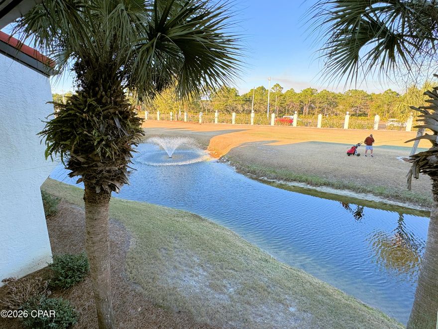 Edgewater Beach Villa 1711 for sale offering spacious rooms, floor-to-ceiling windows and pretty view over pond to golf course.  Fully furnished, this 2nd floor Villa is ready to become your favorite beach getaway or rental investment. The large bedroom has two queen beds, its own bathroom, and balcony access. The full kitchen has a breakfast bar, dining area and laundry. The small yard is perfect for your pets. Steps away, a private heated Villa pool awaits, and beachfront amenities are only a short walk or tram cart ride. Villa owners enjoy exclusive access to Edgewater's Gulf-front amenities, including beach access, tropical pools, hot tubs, a restaurant, market, and pizza shop. The Sports Club at the center of the Villas features a Fitness Center and Pro Shop, with unlimited golf, tennis, pickleball, and shuffleboard for owners. Security is top-notch with manned entrance and beach gates. Convenient building-side parking includes oversized spaces for RVs, boats, trailers, and electric charging stations. Walkable to shopping, dining, and entertainment. Vibrant Pier Park with dog beach is minutes by car. There are new attractions like Top Golf and Dolly Parton's Pirates Voyage Dinner Show. This property is VA approved for a primary residence and provides an active lifestyle as a second-home choice. Reach out today for a Cost To Own Estimate to see how rental income can cover ownership costs. We can help you move into the coastal lifestyle of your dreams!