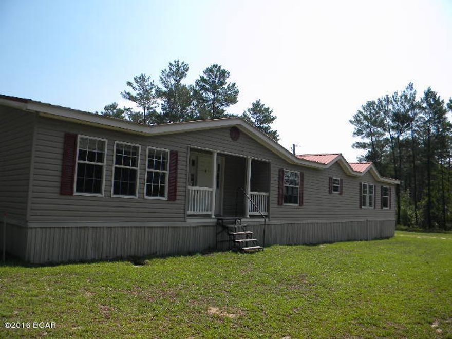 OMG 2290 sq ft, 4 bd, 2 ba well maintained mobile home on 19 acres on a paved road convenient to town with a 36 x 30 pole barn and large rear deck.  Spacious living room with fireplace and built ins around it, large kitchen with an island, dining room and a breakfast nook.  Home is a split floor plan with good sized bedrooms, master bath with jetted tub and separate shower along with dual sinks.  Master bedroom has built ins for extra storage.  Home sits back from the road for privacy.  Pack up the family, horses and other pets because you are going to fall in love with this home.  Better hurry on this one.