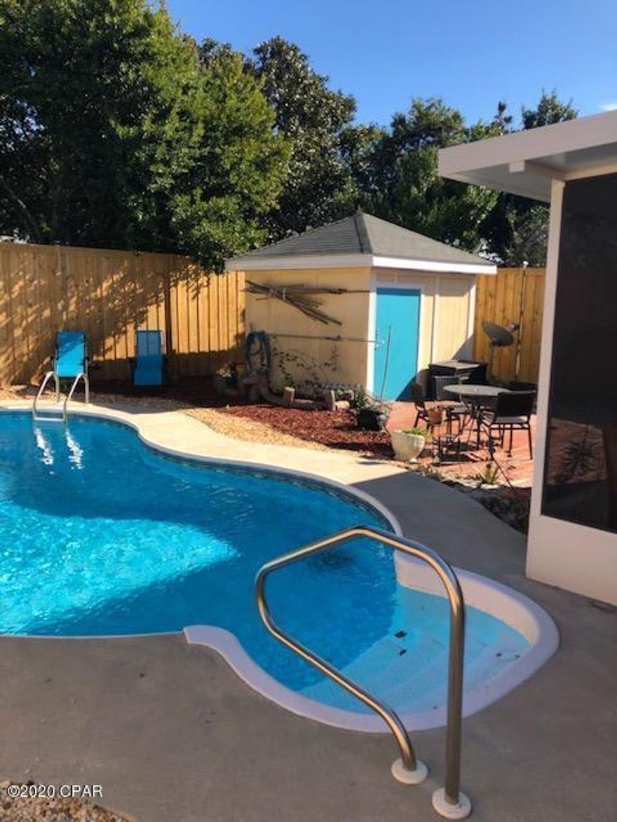 Walk to Beach! just a 2-3 minute walk to the beach or bring your golf cart! Just a few doors over from Maggie Stills Park which is dog friendly.  Many updates have been made to this turnkey beach cottage.  New carpet in both bedrooms, Hall bath Tub and Shower just installed.  Owner installed 8' privacy fence with dbl gate which has solar tops around perimeter. Enjoy your crystal clear Salt Water System Pool in your very private back yeard which was installed 2018.  Upgraded Gas Range, Microwave and Refrigerator all installed end of 2018.  New ceiling fans in LR and Kitchen end of 2019.  New bathroom vanities in both bathrooms in 2018.  New racks and shelving in walk in closet 2019.  New porcelain tile in Kitchen, Living room and ceramic tile in both bathrooms. Screened Florida room newly installed summer 2019. Fresh paint throughout.  Great energy efficient heat pump keeps the utility bills low.  Spacious attic for storage with pull down steps.  Amazing whole house natural gas generator.  We never lost power, internet or satellite during and after Hurricane Michael.  
Convenient to everything.  Easy access to all major roads.  Just a golf cart ride to many favorite restaurants and entertainment.