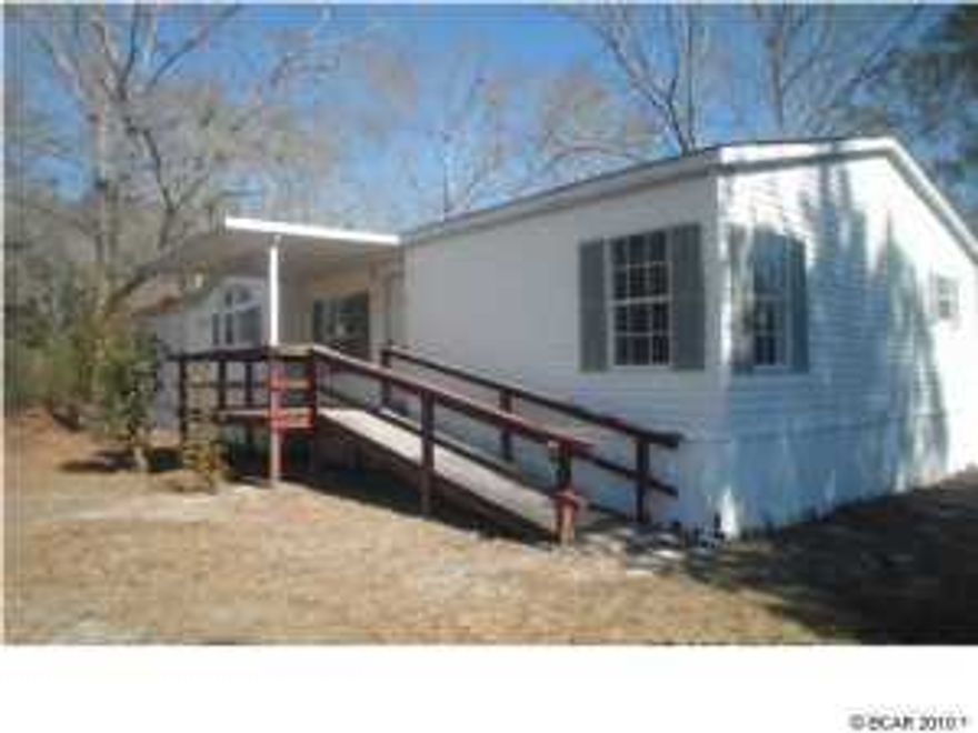 REDUCED...Here's a great opportunity to own a Large 3 bedroom, 2 bath mobile-home on over 1 acre paved road the Southport. Home being sold As-Is.