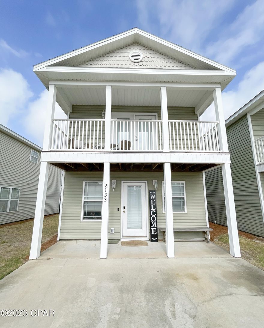 Come and see this update home in Sterling Cove Subdivision.  The home has an open concept downstairs with room for a dining table and a large kitchen with breakfast far.  The kitchen faucet, cabinet pulls and drawer pulls have been updated to gold.  The home has two spacious bedrooms, beautifully, updated bathroom with a walk in shower, double vanity sink and extra storage.  The home comes with a stackable washer and dryer unit.  Enjoy quiet evenings on the balcony from both bedrooms.  Or sit on the covered back porch overlooking the pond with water feature.  The subdivision has electronic gate for security, a community pool, lawn care is provided by the HOA as well as outside pest control.  There are two designated parking spots in front of the home.