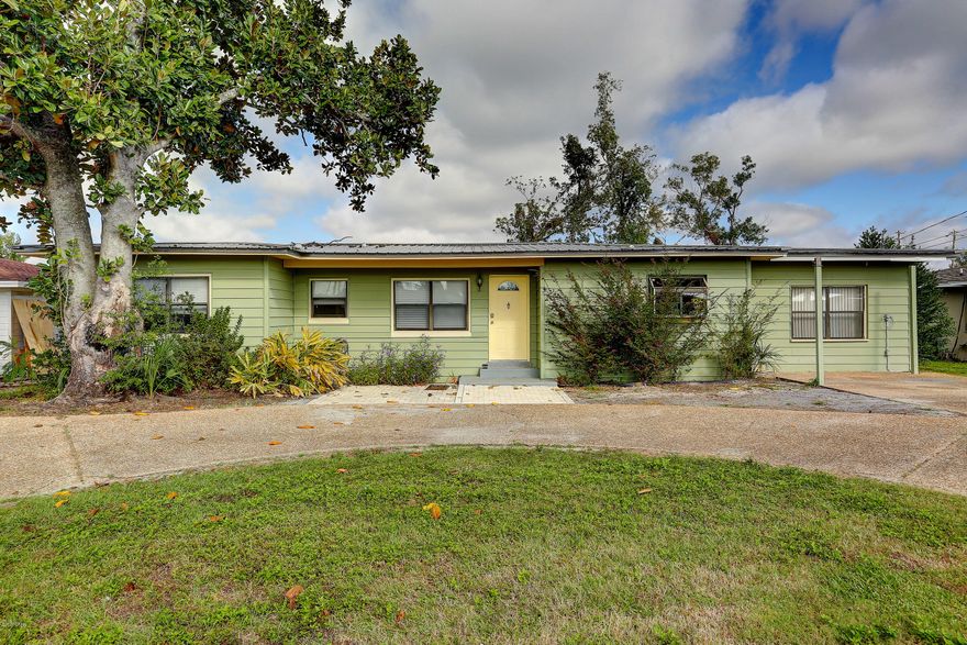 Check out this beautifully done unique 4/3 home in the desirable cove.  Hardwood and tile floors, newly renovated kitchen, big back yard with privacy fence and large back deck perfect for entertaining. House has two A/C units with a wood burning fireplace in the living room, and also has a den and dining room.  This is a perfect home for those looking to live in the Cove, or as an income property with a proven rental history. House has termite bond that owner will transfer. Back on the market! Come see now before its gone!