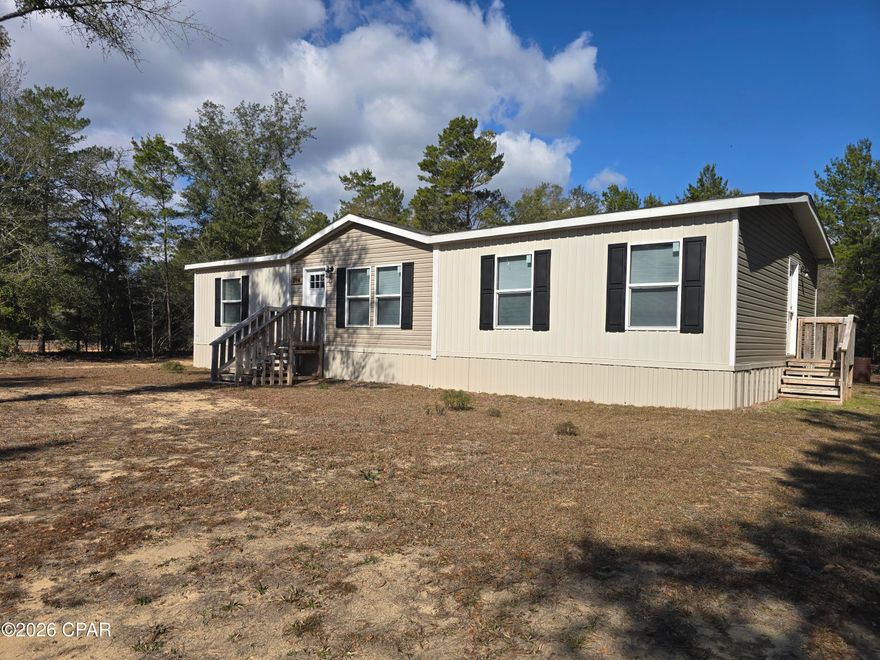 Immaculate 3 Bedroom 2 Bath Home in the Defuniak Springs area! This split floorplan home homes rests on a nearly 1 acre corner lot. The home features an open floorplan concept with main living features such as large center kitchen island, accented living room wall, and large sliding glass entry door that overlooks the private back yard. 

The Master Suite is located on the west end of the home and features a double vanity, shower/tub combination, and walk-in closet. The guest rooms and bath are located along the east end of the home and are accompanied by the large laundry room. This home is priced to move, so schedule your showing today!