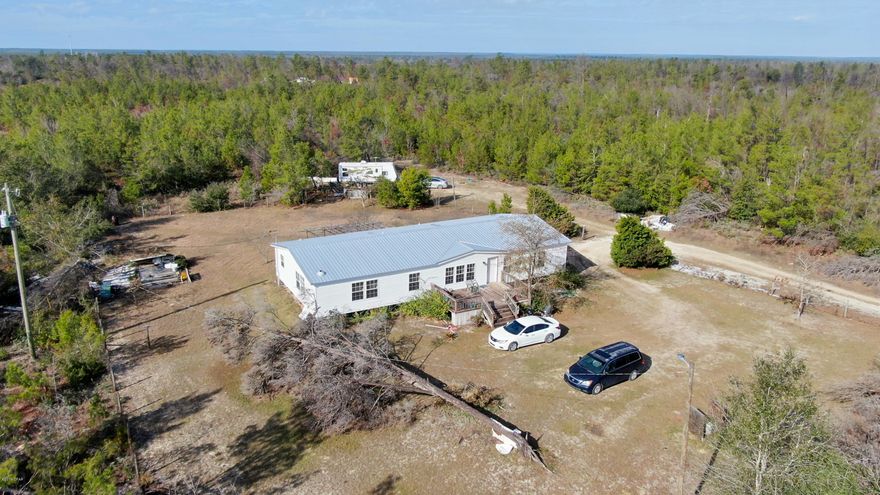 'CURRENTLY UNDER CONTRACT, SELLER ACCEPTING BACKUP OFFERS'. This 10 1/2 acre (mol) property is your future oasis; with a large mobile home, the entire family will be more than comfortable here. 

You are close to the airport, within a quick drive of the beaches and town and medical care, all with the possibility of starting your own farmette/ gentlemen's ranch!

Horses, etc are welcome here.

The house is solid, only in need of some cosmetic updates but it is move in ready and waiting for you to start your new life!