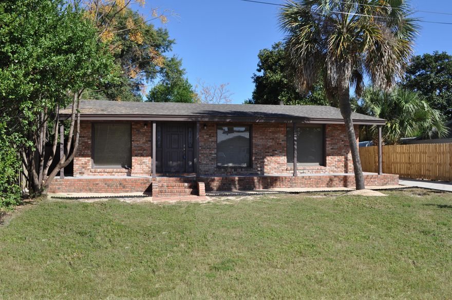 **SELLER SAYS BRING ALL OFFERS!!** You can walk or ride your golf cart to the beach from this 2BR/2BA Open Sands  home!  New roof less than a year old,  AC/Heat replaced 6 months ago, new fixtures in both baths, new carpet and fresh paint and more! There is a bonus room that easily could be converted to a 3rd bedroom or make a great office or computer room. There is a stone fireplace in the living room with large windows to let the light in and all windows have new blinds.  This home has been hooked up to the recently installed sewer system so no worries about tap fees!  Pier Park and Frank Brown Park are close by for your entertainment! Do not miss this one! All info is approx. and must be verified by Buyers if important.