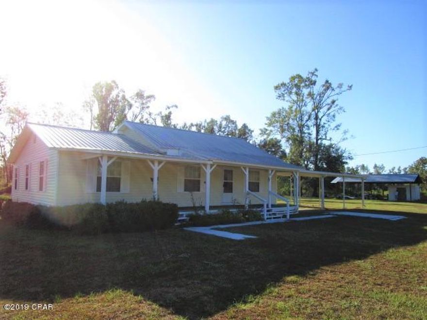 CURRENTLY UNDER CONTRACT, SELLER ACCEPTING BACKUP OFFERS. Very nice home close to national forest and Apalachicola river.  Public boat ramp just a short drive away and plenty of privacy on this 2 acre lot.  There is a large storage shed with metal roof on one side of property and a 3 car carport attached to home.  There is very little traffic as this is on a dead end road.  The home has a very large living room and master bedroom along with a formal dining room that could be converted to make a 4th bedroom.