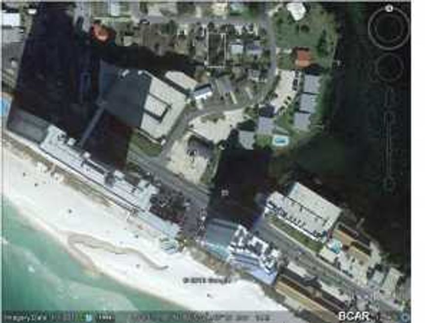 Build a 2 story house on this lot, and you should have views of the beautiful Gulf of Mexico. You will also have a view of Lullwater Lake from the front yard. This lot is in the quiet Lakeside neighborhood, just a short stroll to Beach Access #65, and just 1/2 mile to Pier Park and all it's shopping, dining, and entertainment venues. Public water and sewer are available here, so no need for a septic system. Take a look today, and don't miss this great buy.