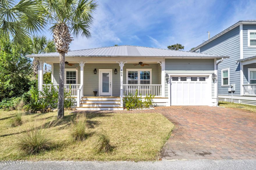 CURRENTLY UNDER CONTRACT, SELLER WILL CONSIDER BACKUP OFFERS. A charming beach house located in a gated community on the west end of Panama City Beach. This 3 bedroom, 2 bathroom house is located only 1/2 mile from the world's most beautiful beaches and conveniently located in close proximity to Pier Park and Rosemary Beach. Featuring new laminate flooring throughout the living areas, a spacious ensuite master bathroom with jetted tub and an outdoor kitchen. Paradise Grove offers residents a community pool, play area and community feel with no short term rentals.