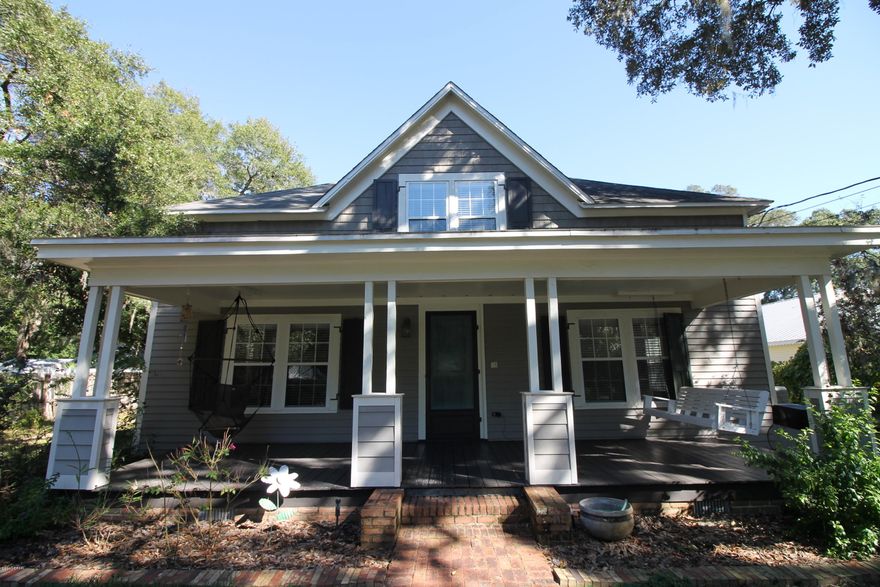 Stunning Restored Historic Victorian Home, available in Historic St. Andrews, This two story home is nestled under magnificent accent oaks trees. Home has 3 bedrooms and 3 bath rooms. This home has been entirely restored over the past 10 years. The first floor offers a kitchen that has custom cabinets, stainless steel appliances, granite counter tops and gas cooking. The home has original wood floors, spacious living area, dining area, office, master bedroom, laundry room and sunroom all on the ground level. Upstairs has a separate living space, and two large bedrooms and bathroom with an original claw foot tub. Most of the rooms have original tongue and groove wood ceilings.  This home has a separated oversized two car garage with tons of storage and cabinets. Out back you will find a magnificent entertaining area with newly built covered kitchen area with concrete floors. This property has lush landscaping and grape vines along the property line. Home is located 1.5 blocks to St. Andrews Bay. This is a must see at this price.