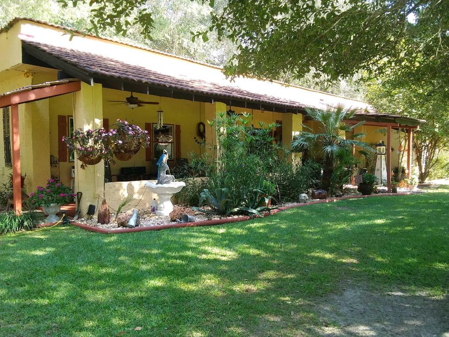 Beauty-Function-Style! This Ranch Home with it's Spanish architecture influence has it all, including Privacy & Security. 15-/+ acres beautiful acres with solar powered security gate that is remote control from the house. The entire property is  fenced and crossed fenced mostly pasture with 5 stall 40' x 60' horse barn, height of 12' to 14 ft. a 32' x 32' Work shop with ribbed metal roof and every tool in its place, 16' x 32' Pole Barn to store your Tractor.  The house is Amazing! The 2800+ sq.ft.home has been updated and upgraded. The Roof has been reinformced with steel beams & cross beams, adding industrial metal that is one length, then Cool Seal  to decrease Power consumption, New A/C & Heat. 4' x 8' M Bath Shower.Pictures can never do justice to this property it is a Must Se