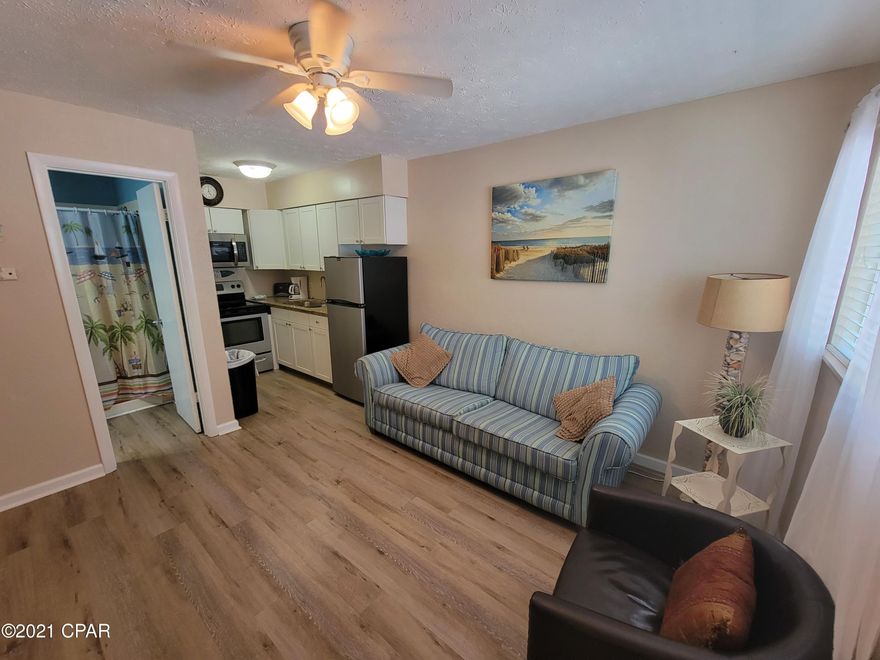 BACK ON MARKET!!! UNIT is currently on a Vacation Rental program. 

This 1/1 unit has been renovated, comes fully furnished and welcomes your guests in. With new LVP flooring and finishing touches. This unit is located just steps from the Gulf this unit stays occupied. Situated in a bustling area of PCB East. It is close to Restaurants, Shopping, entertainment and more. Use it as your own private Oasis, or continue to keep it rented and generate income.  Contact an agent for your private tour.