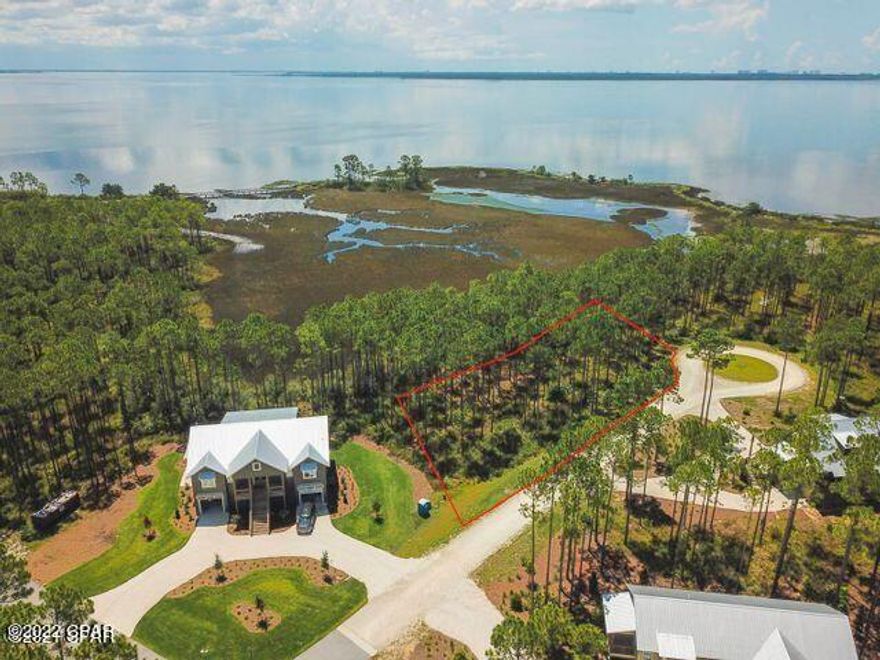 Direct and expansive southeastern views of West Bay from this ''build-ready'' RiverCamps home site. Fully engineered blueprints of a 4 bed 4.5 bath custom one story home, that has the required Developer approval, can be included with the purchase of this lot saving you time and money! Enjoy spectacular sunrise water views from nearly every room of your 2770 heated square foot dream home. Or design/ build to suit on this nearly 3/4 acre Lot located in the highly sought after community of RiverCamps. A 1500 acre gated, waterfront community located 15 minutes from the famous, white sandy beaches of Panama City Beach and less than 10 minutes from the airport. RiverCamps will have less than 450 homesites located on 500 acres with the remaining 1000 acres committed to conservation. Owners enjoy outstanding amenities to include a community boat ramp, dry-boat storage, day-use boat slips, a fitness center, zero-entry pool, 7 miles of trails to hike and bike, unlimited use of kayaks, canoes, paddle boards and bicycles.
*Engineered plans are the property of the Seller and may not be used, copied or reproduced without permission*