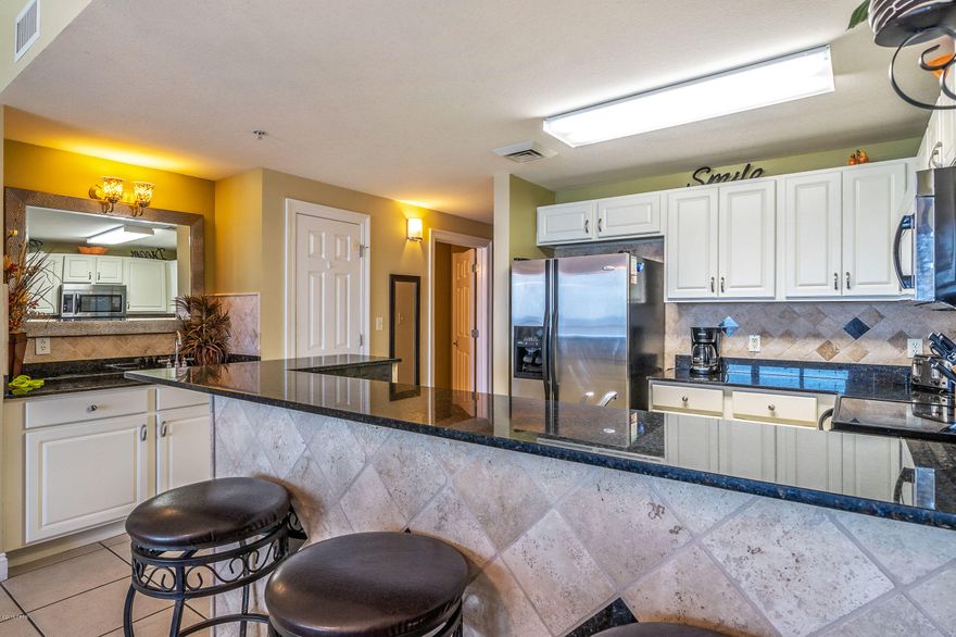 This is the one you have been waiting for!  This beautifully decorated 2 bedroom w/bunk room 2 bath condo features granite countertops, stainless steel appliances, and tile throughout. No carpet!! Experience breathtaking views of the water from your gulf front master bedroom. Watch the dolphins play while you relax on your 24ft wide balcony or head down to the crystal white beach for a stroll to watch the sunset.   Calypso Resort and Towers is the closest condo to Pier Park; the 124 store outdoor shopping center with a Grand IMAX theater, live music venues, and dozens of dining options.  There is no wonder why everybody wants to be at Calypso!  Call today before you miss out on this one!