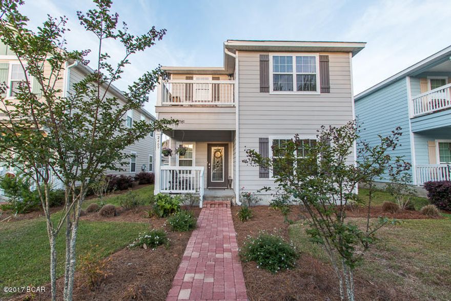 Wait until you see what this home has to offer! It’s unlike any other property in the beautiful, gated community of Magnolia Bay. Not only is this the most popular floor plan, which offers a two car garage and a master bedroom on the first and second floor (both with great size walk-in closets), the owners added a 19x16 Florida room. If you have a growing family or love to entertain friends this home is set up perfect!  The upgrades throughout are endless and you’ll notice them the moment you walk in. Just a few include: hardwood floors, iron stair rails, travertine backsplash, granite countertops in the kitchen and bathrooms, a tile shower in the master, and a fence are just the beginning of the amazing upgrades! Also wait until you see what the community offers.... a playground for the kids, a heated bay front pool, a dock leading out into St. Andrew's Bay, and a beautiful club house with a pool table. This neighborhood is absolutely perfect for entertaining the kids, friends, and family. You're also less than a 10 minute drive to St. Andrews State Park or a public beach access.