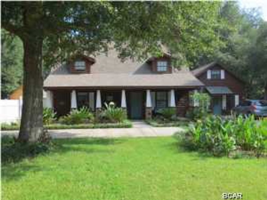 JUST REDUCED! Very nice 4 bedroom 2 bath home with an in-ground pool and a 1 bedroom 1 bath mother in laws cottage that matches the home. Lots of room and storage in this home and has been kept in immaculate condition. You can completely close off the entire right side to create a great master suite with a room that could be used as a huge walk in closet. Room under the stairs to create a 1/2 bath for guest on the first floor. Pool has a vinyl privacy fence around it. Seller built a workshop to match the home for a nice place to complete all those honey do jobs around the house,fenced backyard. Home features a horseshoe concrete drive giving your guest lots of room to park and beautiful landscaping. Come see for yourself! Located near Deer Point Lake, there is a pubic boat launch