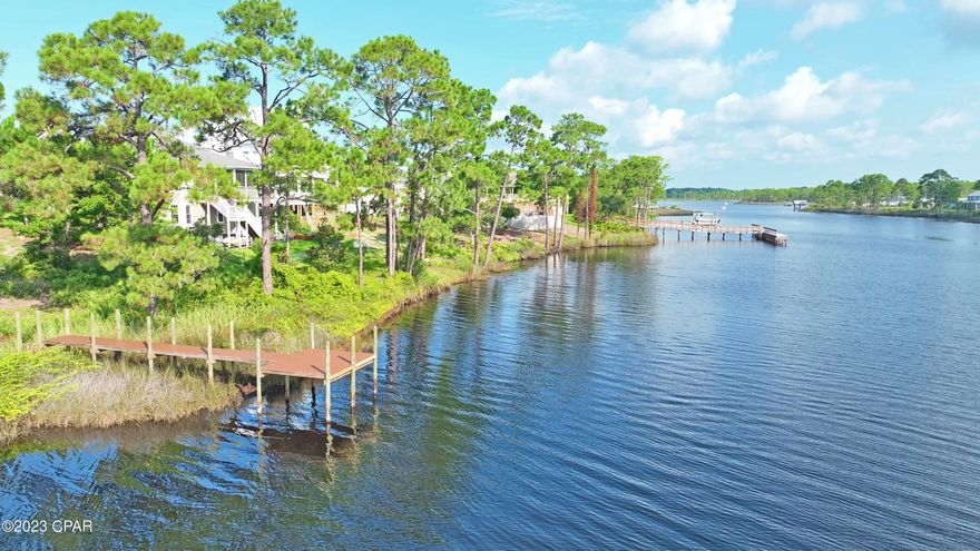 Introducing 314 Turtle Cove, Panama City Beach, FL 

Nestled in the serene beauty of Turtle Cove, this cleared, waterfront property is a true gem. Situated on a generous 0.23-acre lot, it presents a unique opportunity that sets it apart from the rest. This is the only waterfront lot currently with it's own private dock!

Located on the picturesque shores of Lake Powell, this property offers not only a tranquil waterfront setting but also access to the largest coastal dune lake in Florida and North America, offering a truly unique experience.  Lake Powell offers activities like kayaking, paddle boarding, bird-watching, nature study, hiking, and both fresh water and saltwater fishing.  Motor boats and jet skis are permitted on Lake Powell as well.  Such unparalleled access to this unique body of water is a rare privilege, as very few waterfront lots are available at all on Lake Powell.

Immerse yourself in the exclusive amenities of Turtle Cove, where a beautiful waterfront clubhouse awaits. With its state-of-the-art exercise room, inviting pool, and welcoming community room, every day feels like a vacation. Engage in leisurely fishing, enjoy picnics in the delightful picnic area equipped with a BBQ Pit/Grill, and bask in the breathtaking views from the dock. For those seeking an active lifestyle, the tennis courts provide the perfect space to indulge in friendly competition.

314 Turtle Cove presents an exceptional opportunity to build your dream home in a highly desirable location, where tranquility, natural beauty, and an array of recreational options await. Don't miss your chance to claim this waterfront paradise as your own. Act swiftly and make this extraordinary property yours today!