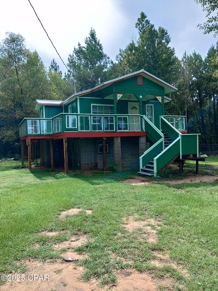UNDER CONTRACT WITH CONTINGENCIES; SELLER ACCEPTING BACKUP OFFERS.
Newly remodeled and renovated homestead located on 1.064 acres with 3-bay pole barn, outbuilding, and fenced in equipment area under another smaller pole barn. This house could also be classified as ''Hunters Cabin''.
The Flint and Chattahoochee Rivers come together for form Lake Seminole.  The boat ramp is 5 miles away.  There are two other boat ramps within 10 miles.  There is amazing fishing and hunting on the land across the highway.  
This home has been completely remodeled to the studs.
All new plumbing including water and sewage pipes, brand new kitchen with pantry and new appliances.
The countertops are a show-stopper, made of 3-inch hand-carved deadhead wood from the Apalachicola River.  Brand new roof with updated wind mitigation report.  Brand new 3.5 ton HVAC system.  The 1st floor has been finished out as a man cave with brand new foam insulated floor joists, this is also a climate controlled area.  The new deck goes around 2/3rds of the home.  Brand new CAT-5 hurricane resistant windows were installed.
This home is meticulously maintained and pride of ownership is exhibited in every square inch of this home.
The owner spent well over $100,000 bringing this property up to today's standards and the new owner will step into a home that is built solid with expert craftsmanship throughout.