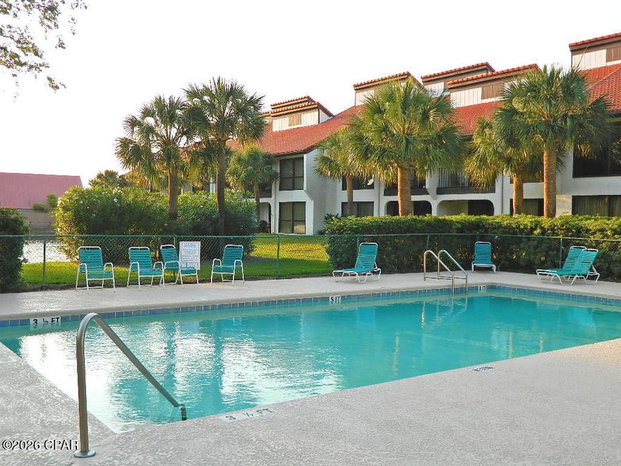 This ground floor layout is an extra-large end unit with three bedrooms at the iconic Edgewater Beach & Golf Resort. This spacious unit has floor to ceiling sliding glass doors that open to an oversized covered patio. There is easy care tile flooring and vinyl luxury plank throughout. A mirror wall in the living room increases the sense of room size (see photos for an example of modern frame update). All three bedrooms are spacious, inviting, and functional. The owner's suite has its own bathroom, walk-in closet, and patio access. The split floor plan puts the guest suite down the hall with its own bathroom, queen beds, and sliding glass door to a patio. The third bedroom offers access to the guest bath. There is a full kitchen with granite countertops, beachy-look white cabinetry and appliances, breakfast bar, dining area, and a convenient in unit laundry. This Villa is offered fully furnished; rental or move-in ready. With strong rental potential, a prime location near the street walkover and sports club, along with the privacy of the Villas, this property is ideal as a vacation home or rental investment. Owning a Villa at Edgewater means embracing a lifestyle centered around relaxation, recreation, and convenience. Enjoy tropical pools, hot tubs, splash pad, golf, pickleball, tennis, fitness facilities, on site dining and market, and private beach access--all within a gated, beautifully maintained resort. A personal beach retreat or rental investment with an active lifestyle focus.
