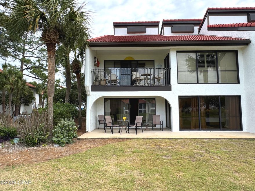 This ground floor layout is an extra-large end unit with three bedrooms at the iconic Edgewater Beach & Golf Resort. This spacious unit has floor to ceiling sliding glass doors that open to an oversized covered patio. There is easy care tile flooring and vinyl luxury plank throughout. A mirror wall in the living room increases the sense of room size (see photos for an example of modern frame update). All three bedrooms are spacious, inviting, and functional. The owner's suite has its own bathroom, walk-in closet, and patio access. The split floor plan puts the guest suite down the hall with its own bathroom, queen beds, and sliding glass door to a patio. The third bedroom offers access to the guest bath. There is a full kitchen with granite countertops, beachy-look white cabinetry and appliances, breakfast bar, dining area, and a convenient in unit laundry. This Villa is offered fully furnished; rental or move-in ready. With strong rental potential, a prime location near the street walkover and sports club, along with the privacy of the Villas, this property is ideal as a vacation home or rental investment. Owning a Villa at Edgewater means embracing a lifestyle centered around relaxation, recreation, and convenience. Enjoy tropical pools, hot tubs, splash pad, golf, pickleball, tennis, fitness facilities, on site dining and market, and private beach access--all within a gated, beautifully maintained resort. A personal beach retreat or rental investment with an active lifestyle focus.