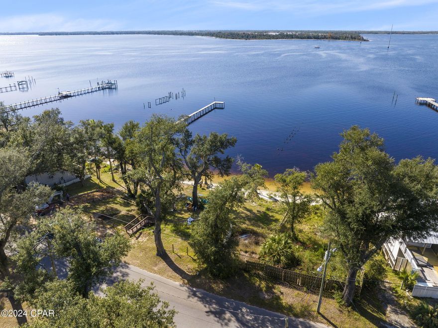 This is an incredible opportunity to own a large water front residential lot in Panama City! Zoned in the city of Parker as Mixed Use 1. Boasting over 3/4 of an acre with plenty of room to build your dream home or an income producing property. The waterfront portion of the property is on the south side of Pitts Avenue with the larger portion on the North side. Short drive away from historic downtown Panama City as well as a boat ride away from the Inlet and the Gulf of Mexico. This is incredible value due to location to Tyndall and Downtown PC!