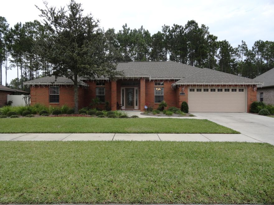 Contemporary brick POOL home in desirable Hawks Landing.  This 4 bedroom, 2 bath home with heated and screened in salt water pool and Jacuzzi is move in ready.  Private backyard overlooks woods for peace and tranquility. There is plenty of room to entertain outside on the porch with cozy sitting, dining and sunbathing areas. Inside is a fire place, built-in shelving, formal dining, breakfast bar, kitchen dining, large master bath with Jacuzzi tub, tiled shower and a walk in closet.  Three additional bedrooms are on the opposite end of the house and can be closed off with a pocket door for noise control.   Hawks Landing offers walking trails and a charter K - 8th school at the entrance.  Their irrigation uses reclaimed water which is a major cost savings!