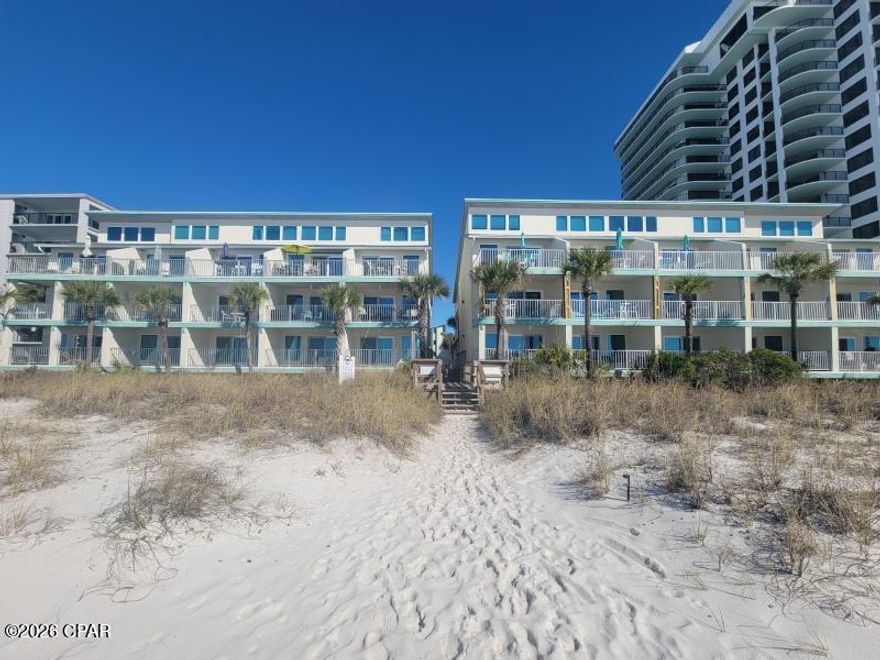 Welcome to Nautical Watch Condominiums- This isn't just a condo—it's your front-row seat to the Emerald Coast lifestyle! Located, just steps from the sugar white sands of Panama City Beach! Gorgeous Beachfront Condo with amazing breathtaking views! This corner-end unit retreat could be your Perfect Getaway or Investment Opportunity. This Low-rise 2nd floor unit is a 1BR/1BA and is tastefully decorated and being offered fully furnished. Features tile flooring throughout. Granite countertops in kitchen and bathroom. In recent years, the windows & sliding glass doors have been replaced as well as the HVAC system which bring comfort, efficiency, and peace of mind.
This community offers private beach access with an electronic gate. Plus take advantage of the beautifully landscaped pool area with outdoor grilling stations, tables and lounge chairs ideal for entertaining family and guests. 
Nearby is St. Andrews State Park where outdoor enthusiast can go kayaking, paddle boarding, fishing, and stroll scenic hiking trails. Also, this low dense complex is conveniently located to shopping, dining, family entertainment attractions, and the vibrant nightlife of PCB. Short-term and long-term rentals are allowed, making this an exceptional opportunity to enjoy personal use while generating income in a high-demand beachfront location. This is the coastal lifestyle you've been dreaming of—and deserve. Make it yours before someone else does. Call today to schedule your private tour of this highly desirable beachfront community.