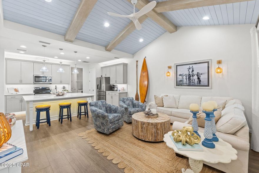 Welcome to coastal living at its finest in Latitude Margaritaville Watersound, a premier 55+ active adult community offering unmatched lifestyle and world-class amenities. 

This Camellia cottage, ideally located in close-in Phase 2 and within walking distance to all the world class amenities, is being sold fully furnished, including a golf cart (signed memorabilia excluded).

This highly upgraded home features an inviting open-concept great room highlighted by shiplap walls and a beamed ceiling, creating a warm yet elegant coastal ambiance. The designer chef's kitchen boasts a large extended island, quartz countertops and quartz backsplash, undercabinet lighting, upgraded cabinetry, double-oven range, and a stylish coffee/wine bar area. A spacious separate dining room with a striking feature wall provides the perfect setting for entertaining.

The primary suite is a true retreat with a designer feature wall, custom sliding door, shiplap accent wall, custom lighting, and a luxurious spa-inspired bath featuring a floor-to-ceiling tiled shower with frameless enclosure. Both the primary and secondary bedrooms offer custom closets. The beautifully appointed secondary bedroom is conveniently located adjacent to a full tiled bath.

Additional highlights:
Custom palm tree, 
Whole-house water purification system,
Designer paint throughout, High-end designer furnishings throughout, Custom light fixtures and bathroom mirrors, All TVs convey, Garage refrigerator included,
Screened porch with tile flooring, perfect for relaxing and enjoying the coastal breezes, Golf-cart with new batteries 2025.

This exceptional home offers a rare opportunity to enjoy a fully furnished, move-in-ready cottage in one of Latitude Margaritaville Watersound's most desirable locations—just steps from the community's celebrated amenities, events, and lifestyle.

A perfect primary, second home or investment property ready for immediate move-in. Living in Latitude Margaritaville Watersound means embracing a true resort-style, active adult 55+ community, coastal lifestyle designed for fun and relaxation. At the heart of it all is the Town Square where live entertainment fills the air on a daily basis and every Fri/Sat. night!

Homeowners enjoy the Resort-style pools- perfect for lounging in the Florida sunshine or enjoying a swim with friends. State-of-the-art fitness center & group classes - including yoga, spin classes and lap pool and spa, water aerobics to name a few. Walking, biking, and golf cart trails that wind through the community with easy access to all amenities and a underpasses for safe and convenient access throughout the neighborhood. Sports courts - including pickleball, tennis, and bocce, basketball encouraging friendly competition and active living. Kayak launch for adventure seekers, Last Mango Theater for shows and events, ceramics and wood working shops, pet grooming and a dedicated dog park. 

Beyond the amenities, Latitude Margaritaville Watersound offers a low-maintenance lifestyle—with lawn care, exterior painting/roof replacement on a maintenance schedule included in HOA dues, a 2/10 structural warranty (from the original buyers close date), giving residents more time to enjoy the beach, boating, or exploring nearby Panama City Beach and 30A. A future shopping complex to include a Publix grocery store-coming 2026, dining and shopping options and a public marina is planned on site. New hospital currently being built 5 miles from the community (coming 2027). 

Whether it's a sunset golf cart ride, cocktails by the resort style pool, or mingling with neighbors at one of the many social groups, this is a place where every day feels like a vacation. This home is more than just a showcase of luxury and upgrades—it's a gateway to the Latitude Margaritaville lifestyle. This beautifully upgraded and meticulously maintained home in prime phase 2 LMWS location is ready for you to move in and enjoy the Latitude lifesty