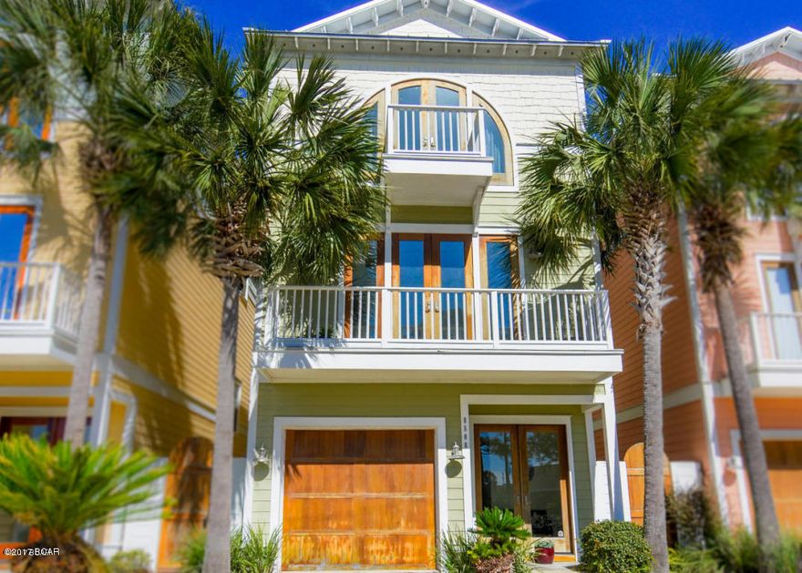 Upscale Water front home on Grand Lagoon with a view of the Gulf of Mexico!, Make it your home or a vacation home with great income possibilities. Watch the swim in your backyard.  A short boat ride to Shell Island on the Gulf of Mexico. 12’x 24' deep water boat dock with full hookups, located in a quiet neighborhood just 2 minute walk to the Beach. This home features fine finishes throughout, including 8 foot Mahogany exterior doors,  hurricane resistant windows, metal roof, 10'-14' ceilings, granite countertops throughout, top of the line Thermador stainless steel appliances. Four private balconies overlooking the Lagoon and the Gulf of Mexico, one of the very few homes with a view of your boat on the Lagoon and a view of the Gulf on your front balconies.  Features a spa-like bath. and a Jacuzzi tub. Includes a custom built elevator with service to all 3 floors. Huge living room which opens onto an expansive balcony with a stunning view of Grand Lagoon.