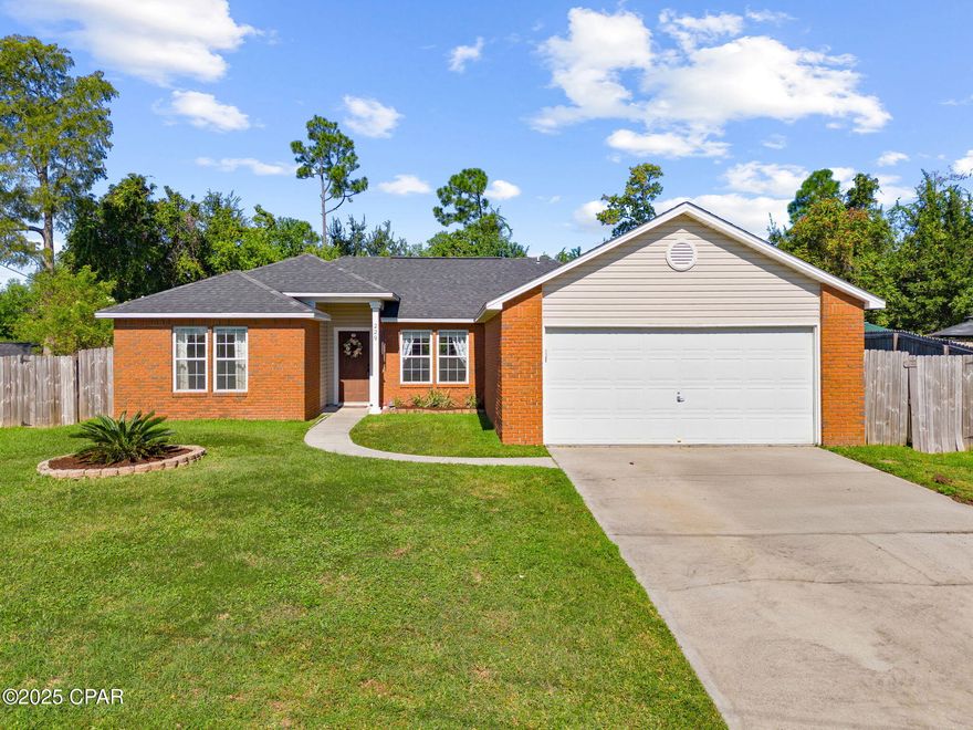 Cozy Brick Home with Private Wooded Backyard

Tucked away in a quiet cul-de-sac, this charming brick home is a peaceful escape, just 6.8 miles from Tyndall AFB and 14 miles from Panama City Beach. The wooded backyard gives you plenty of privacy, and the street is so calm it's perfect for anyone looking for a little serenity.

Walk through the front door into a welcoming hallway that sets the tone. To the right, you'll find a formal dining room and a spacious kitchen with warm wood cabinets, tons of storage and a large farm sink. Next you will find the oversized living room with a ton of windows letting in natural light—great for hosting friends or just relaxing at home.

The layout splits the bedrooms for extra privacy. The master bedroom has a tray ceiling and a view of the woods for a serene backdrop. The master bathroom has a vanity, shower, and a walk-in closet. On the other side of the house, there are two spare bedrooms that share a bathroom with a tub-shower combo and a single vanity. There's also a washer and dryer nook in that hallway.

Updates include a new roof in 2018, air handler and condensing unit 2018 and a new wood deck 2025. The vinyl flooring in the living room and Florida room was redone in 2022, and the dining room, office, and master bathroom got fresh paint last year. FPL moved the power lines underground in 2025, which is a huge plus! 

The backyard is private and green, with two lemon trees, a few elderberry trees, and a palm tree. A shed gives you extra storage, and there's a hot tub for unwinding after a long day.