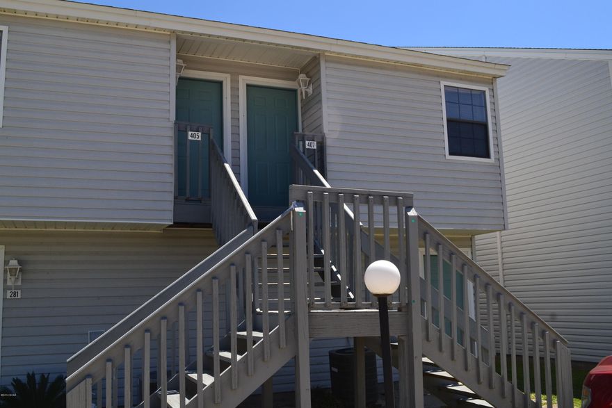 Waterfront Condo located on 28 acre Lullwater Lake and across the street from the Panama City’s Word Famous Beach!   A wonderful opportunity to purchase an incoming producing 2 bedroom, 2 bath condo, in a low-rise, quiet resort.  This unit is a 2nd floor unit with a great view of Lullwater Lake not only from the living room, but from the master bedroom and has been freshly painted, and carpets cleaned prior to listing. It is move-in ready and just waiting for the perfect buyer looking for PARADISE.  The downstairs consist of a living/dining combo overlooking the lake with sliders leading to the private deck.  The second bedroom, laundry area, kitchen, wet bar, and full bath are on the bottom floor also.  The master bedroom and bath are on the 2nd floor with a great view of Lullwater Lake If you have been looking for an investment that will cash flow, second home getaway, or a primary home, this one is for you!  Located less than a mile from Pier Park, you are in the heart of shopping, restaurants, and attractions.  Amenities include a pool overlooking Lullwater Lake, shuffleboard, multiple grill areas, and multiple docks to watch the sunset or enjoy an afternoon of fishing.   If this sounds like the investment you have been waiting for, call today to schedule your showing appointment before your dream becomes someone else's reality... This home is just waiting for you!!!!!  Age, Sq.Ft., Taxes, School System, Room Dimensions, or any important information is an estimate and must be verified by the buyer if important.