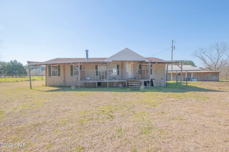 Welcome to 7.74 acres of prime real estate in Bonifay. Conveniently located on HWY 79. This property is ideal for anyone looking to have a farm with their cows, chickens, horses, dogs and whatever other wildlife you have. There is a modular home on the property that will need renovation or tear it down and build your dream home. An enclosed and open pole barn makes it perfect for animals or if to turn into an event venue for weddings or gatherings. This property has endless possibilities. There is also a 1/2-acre pond to enjoy not currently filled but can easily be filled. Fully fenced property with gorgeous pecan trees. This prime real estate is perfect for family living farming or anyone seeking the country life but still within the city reach.