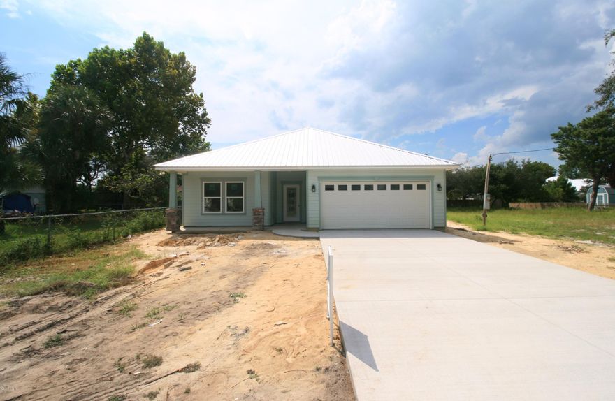 An Open Living Plan with 9' ceilings throughout and tons of charm.  Located less than two blocks from the beach. The oversized yard has room for a pool and RV parking on the side of the house.  Home features include: Samsung stainless appliances, beautiful granite counters throughout, sold wood cabinets with soft closure drawers, French doors that lead out to a huge covered patio, metal roofing, luxurious tile backsplash in the kitchen and the shower surrounds, brushed nickel fixtures, energy efficient LED recessed lighting, huge back porch, a wonderful covered front porch perfect for rocking chairs, lush landscaping, lawn irrigation and so much more...

Scheduled to complete around 9/26.

*all important data must be verified.