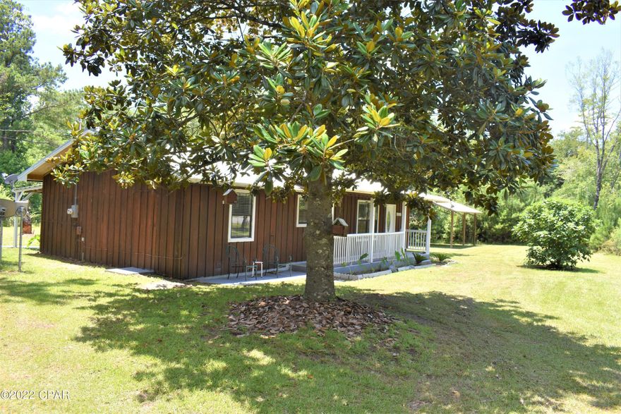 CURRENTLY UNDER CONTRACT, SELLER ACCEPTING BACKUP OFFERS! Country home on a couple of acres minus the dirt road!!! This is the property you've been looking for at an affordable price.  Upon arrival, you will be immediately drawn to the breathtaking magnolia trees that create the perfect landscape for this home. Updates include a new metal roof and a new HVAC.  The french doors in the master bedroom open up to a covered patio providing a perfect place to unwind from a long day. Bring your rocking chairs to relax on the spacious covered front porch.  To make this even more appealing, it  includes a pole barn, outbuilding for storage and a deer stand.  Don't miss out on this one - contact your favorite realtor to schedule a showing!