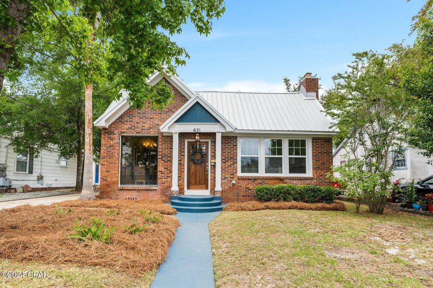 CURRENTLY UNDER CONTRACT, SELLER WILL CONSIDER BACKUP OFFERS.  Step into history with this charming 1930's 3 bed, 2 bath home nestled in the coveted Cove neighborhood. A stone's throw from downtown, this home seamlessly blends old-world charm with modern convenience. Revel in original hardwood flooring, and transoms above every bedroom door. A touch of elegance is seen in every corner of this updated Cove cottage. 

Indulge in recent updates including a new HVAC unit, all new plumbing, electrical, windows tankless hot water heater, and an en suite bathroom for the master bedroom. The detached garage boasts a new concrete floor, new concrete patio perfect for entertaining or relaxing under the stars. 

The heart of this home lies in its beautifully revived kitchen, featuring E F San Juan custom cabinets and new appliances with a built-in banquet, inviting you to savor every moment shared within its walls. Don't miss your chance to own a piece of history, meticulously restored for modern living.

Beyond its physical features, this home holds a special place in the community's heart as the former residence of the esteemed Mrs. Lucille Moore, a beloved historical education figure. Her legacy adds immeasurable value and significance to this already remarkable property.

Sellers are Florida licensed real estate agents. Sellers are related to the listing agent. 

ALL MEASUREMENTS ARE APPROXIMATE, BUYER TO VERIFY IF IMPORTANT.