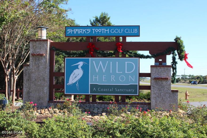 Must sell! Low priced home site in Wild Heron- a 734 acre subdivision with the award winning Shark's Tooth Golf Course designed by Greg Norman. Wild Heron is located approximately 2 minutes from the Beach and a short ride from Rosemary Beach. This great elevated, wooded home site is ideally located at the end of Shark's Tooth Trail near Holes 13 and 14. Amenities include Prospect pool and hot tub overlooking Lake Powell, a Community Dock and Boat House with kayaks and canoes, fitness center, outdoor pavilion, fire pit and playground. With a separate membership, you can enjoy the challenging golf course, beach club and tennis courts.

Enjoy this beautiful relaxing setting  so close to the world's most beautiful beaches and Pier Park with hundreds of shops, dining and entertainment.