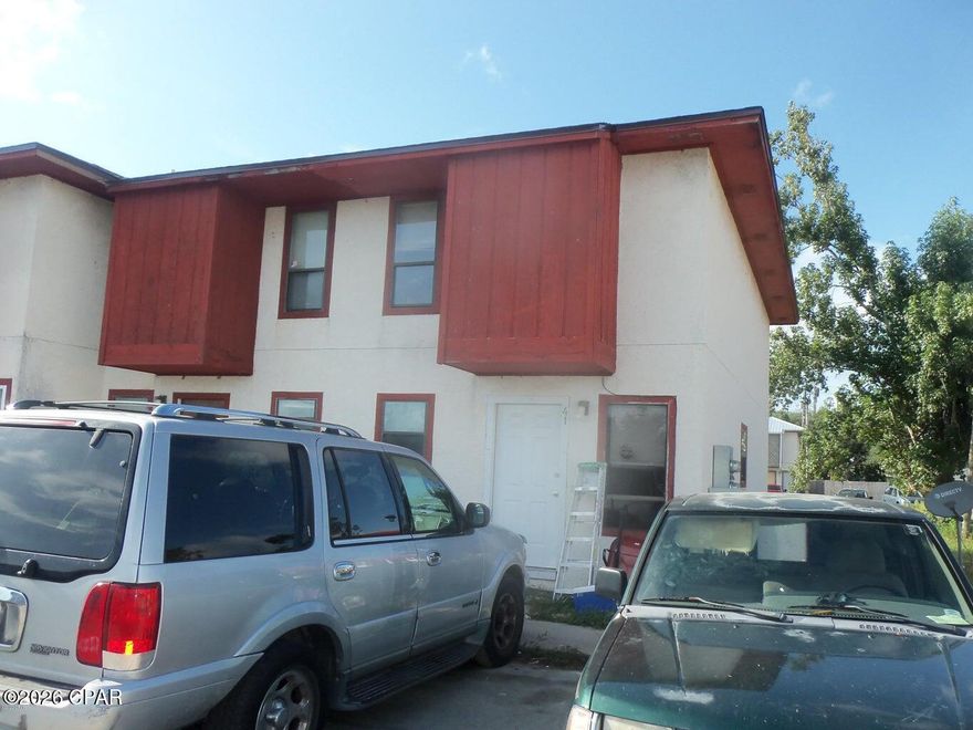 Attention Investors! End-unit townhome centrally located near local colleges and just minutes from the Hathaway Bridge for quick access to the beaches. Conveniently situated approximately 4-6 blocks from both Gulf Coast State College and FSU Panama City, making it a desirable location for student or long-term rental opportunities.

This 2-bedroom, 1.5-bath townhome has a spacious main level featuring an open living area with a kitchen/dining combination, half bath, and laundry room. Upstairs, the two bedrooms share a Jack-and-Jill style full bathroom. The property also offers a rear patio deck for outdoor space.

The roof was replaced in April 2019.

Important: This property is being sold strictly AS-IS, and the seller will make no repairs. Buyer should conduct their own inspections and due diligence.

Priced competitively, this is one of the best-priced townhomes in Panama City, offering strong potential for investors or buyers looking for a centrally located property near schools, shopping, and the beach.