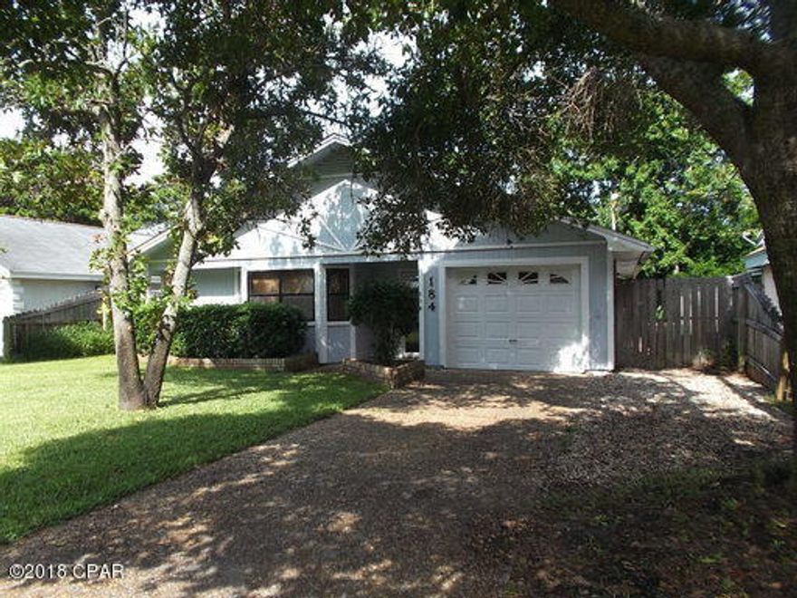 Single family home with brick fireplace, one car garage, storage room at back patio, outdoor storage building, eat-in kitchen with large pantry, and fenced backyard.



All dimensions are approximate