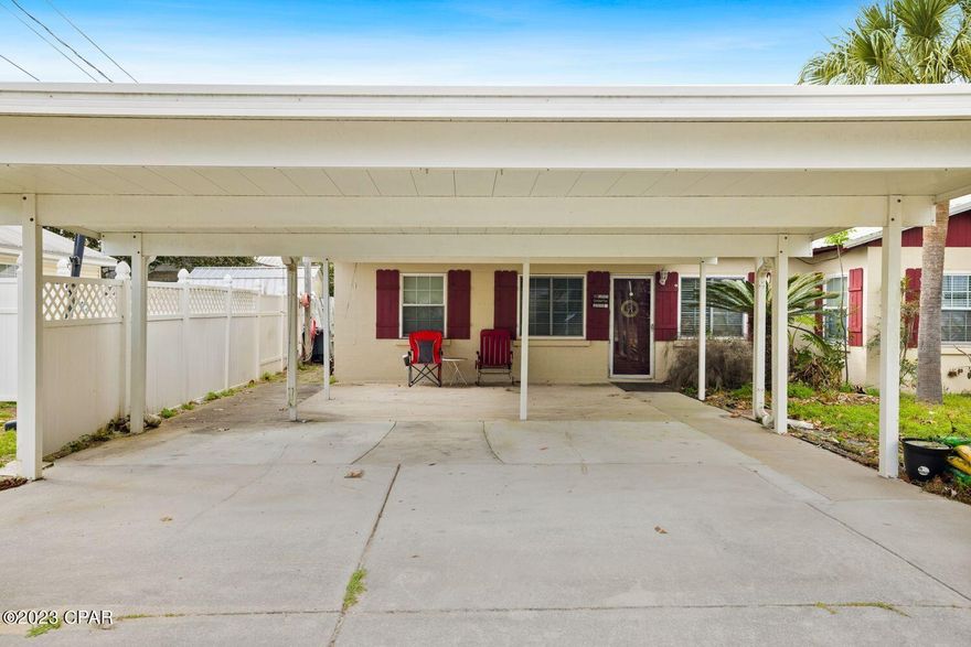 Price Reduced! Lowest priced home in the Laguna Beach area.  A great investment property and turn key beach house on the desirable South West End.  Only 3 blocks from the beach and straight shot to the beach access.  This Florida cottage is a 2 bedroom, 1 bath home in the desirable Malaga Place/Laguna Beach. Excellent location in proximity to Highway 98, Pier Park and 30A.  Home has been remodeled with new kitchen, granite counters, new cabinets, and stainless-steel appliances. Custom wood pine and raised ceiling throughout. Plumbing and electrical upgraded.  A Metal roof and the air conditioner is 5 months old. Home comes with a generator and two outdoor shed/workshop. The carport driveway is fully covered, thus keeping your cars out of the sun. Comes with Golf Cart depending on purchase offer. This home is perfect as a vacation or short-term rental. Annual short term rental projection around $49,000.