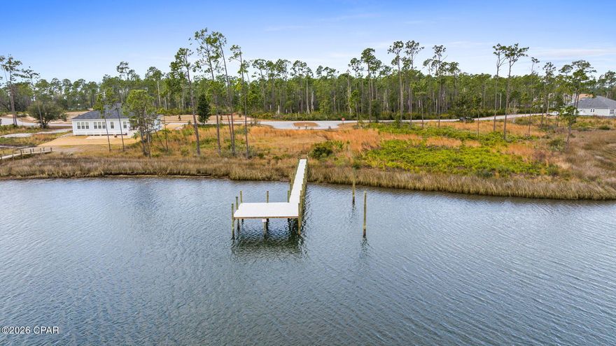 Best-priced deep-water, waterfront lot with private dock in Bay County — located in the gated community of Laird Point. This rare find offers direct access to the bay and Gulf, ideal for fishing, boating, and dolphin-watching in Laird Bayou. Laird Point amenities include tennis/pickleball courts, RV/boat storage, and secure gated access for privacy and peace of mind. Convenient to Tyndall AFB, Mexico Beach, Eastern Shipbuilding, shopping and dining. Build your dream home and enjoy weekends sports-fishing or relaxing at Shell Island with the locals. Don't miss this exceptional value — call your Realtor today to tour the property.