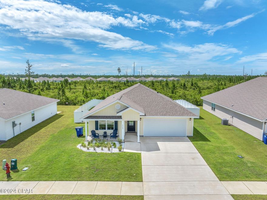 CURRENTLY UNDER CONTRACT, SELLER WILL CONSIDER BACKUP OFFERS 4 Bedroom/2 Bathroom ''CALI'' floor-plan in the highly desired 'Liberty' Community! Located just off Hwy 231 and Star Ave. minutes from Tyndall AFB, shopping, restaurants, and more. Liberty offers beautifully designed landscape with an abundance of amenities including a 7,500 sq. ft. community center with fully equipped fitness center, wellness rooms, resort style pool, splash pad, outdoor kitchen, playground and so much more! Interior showcases a split floor plan with luxury vinyl plank flooring and recessed lighting throughout. Situated off the entry way sits two secondary bedrooms and full guest bathroom featuring a tub/shower combo. While adjacent sits the third bedroom, laundry room, and garage access. Kitchen features stainless steel appliances, walk-in pantry, kitchen island/ breakfast bar, and eat-in dining area overlooking the living room. Master bedroom and en-suite features double vanities, soaker tub, separate shower, and walk-in closet. Exterior showcases a spacious covered front and back porch, and large privacy fenced backyard backing up to a quiet wooded scenery. 

Call to schedule your private showing today! All Measurements approx. buyer to verify if important.