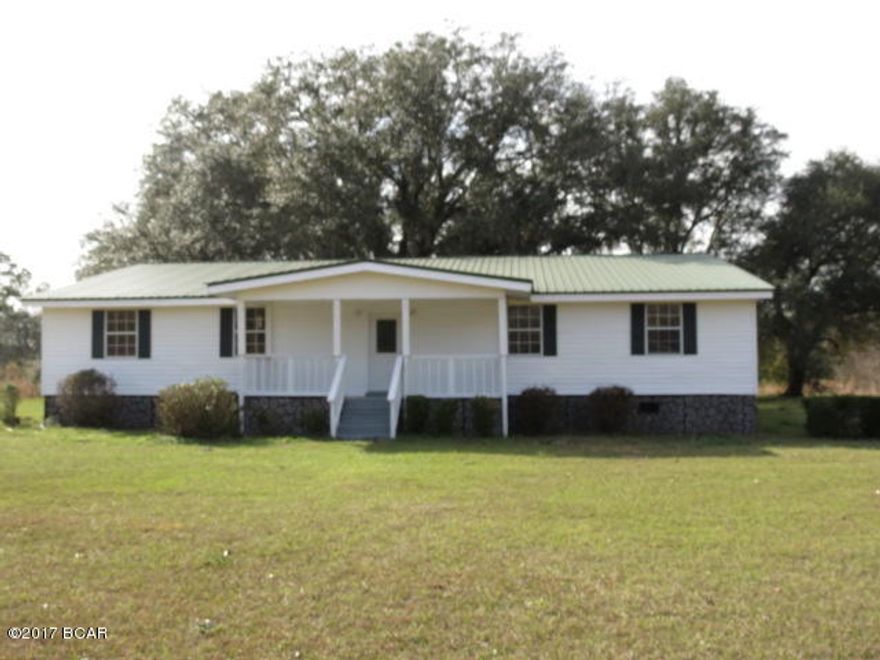 This Very Nice 6/2 home features new vinyl flooring, new carpet, new bathroom vanities, new dishwasher, new electric fireplace in living room, large dining room/den, handicapp accessible, new central heat and air, new well pump, metal roof was put on in 2010, a very nice and large(40x20)workshop that is wired 110 with electric garage door. All sitting on 5.50 ac with pond. MAKE YOUR APPOINTMENT TODAY!!