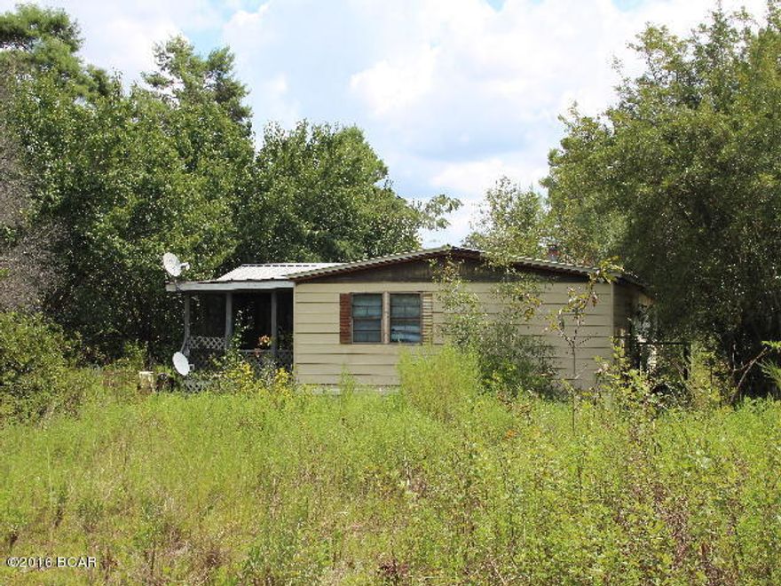 This is a 4.55 acre tract of land with an older mobile home of no value The value is in the land. It would make a good investment property or a good place for a camp house. It has some nice shade trees and is in a country setting.