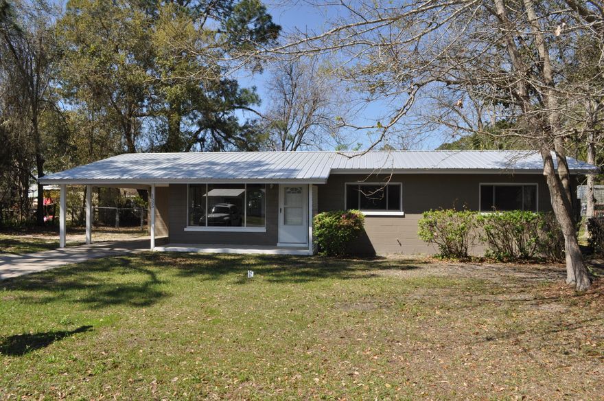 Updated and move-in ready home with brand new metal roof!  This home is block construction with three bedrooms and 1.5 baths and is close to schools, shopping and 10 minutes from Tyndall AFB.  The kitchen has brand new cabinets and appliances and the whole home has been repainted inside and out.  There is a very large laundry/storage room at the end of the carport and the backyard is fenced.  This is a great home for first-time buyers!  All info is approx. and must be verified by Buyers if important.